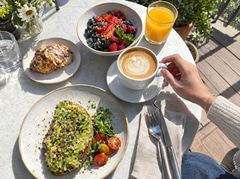Casual phone photo of a weekend brunch table from above