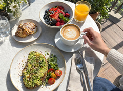 Casual phone photo of a weekend brunch table from above