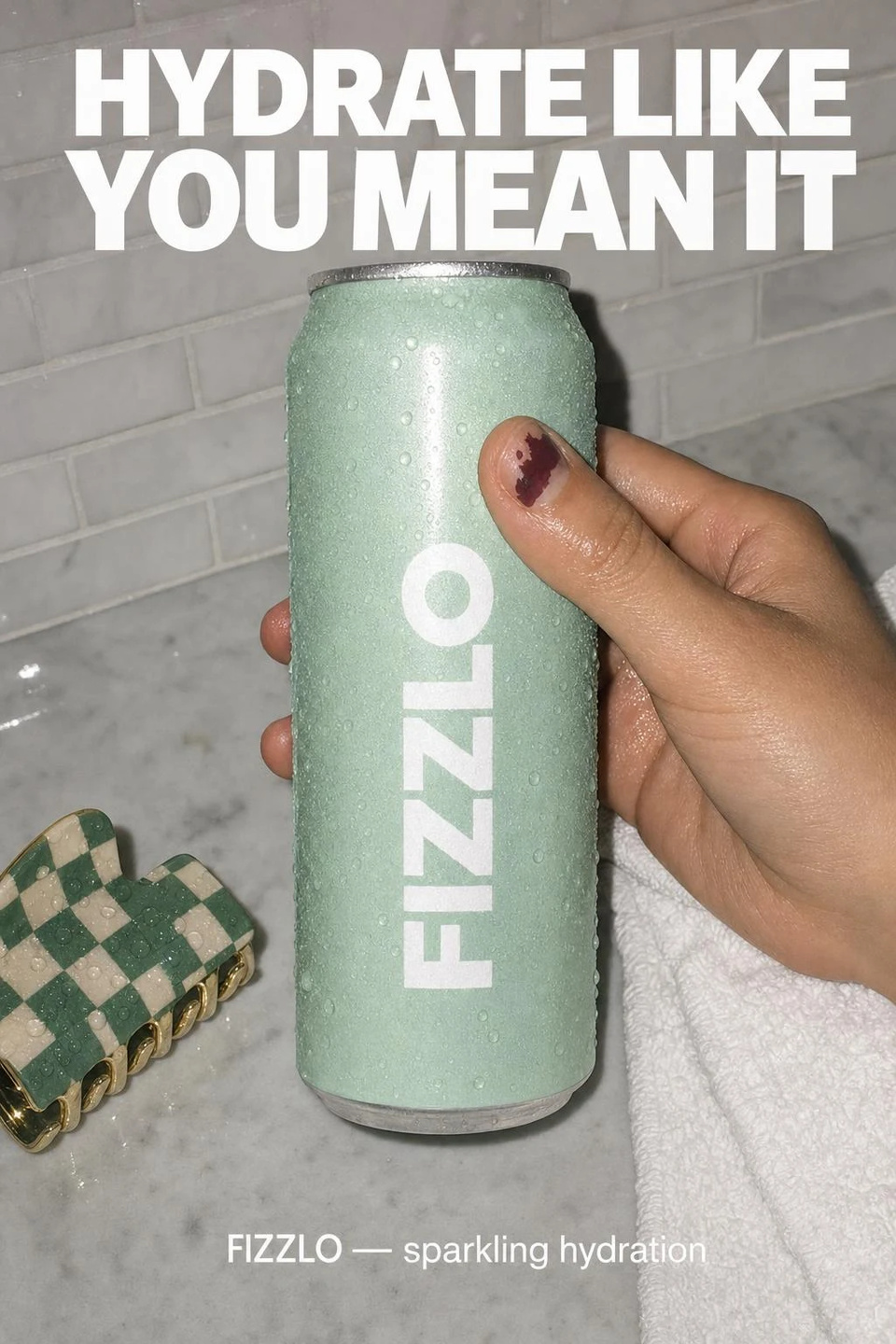 A flash photo of a hand grabbing a mint FIZZLO can on a bathroom counter under the headline HYDRATE LIKE YOU MEAN IT
