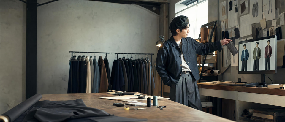 A fashion label founder seeing one jacket in several colourways in her studio