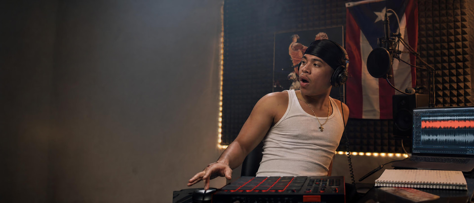 A beatmaker in his home studio hearing a voice sung over his finished beat